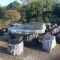 Table and stools in red sanba stone from Japan